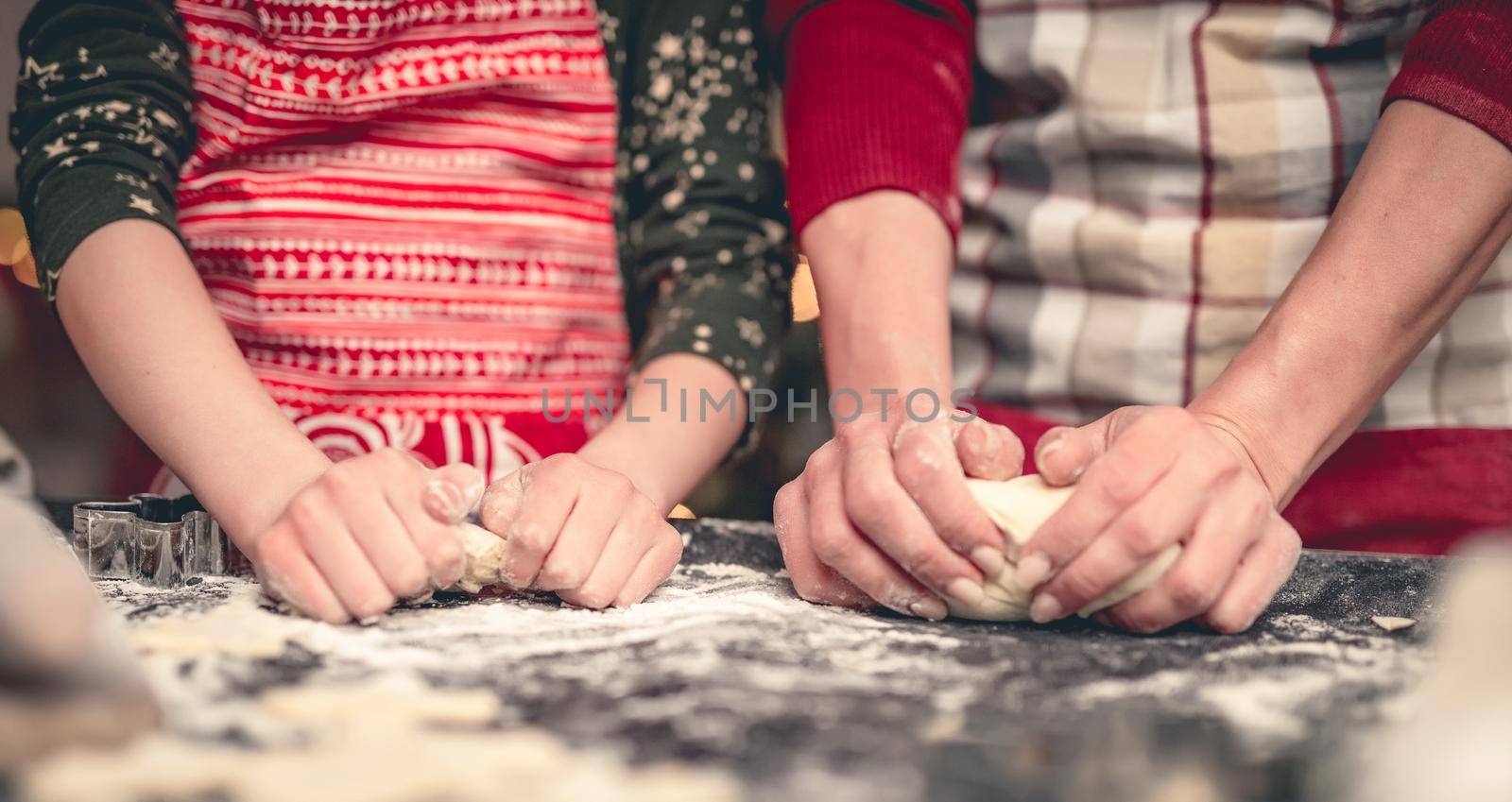 Making of gingerbread dough for christmas by mother and daughter at home