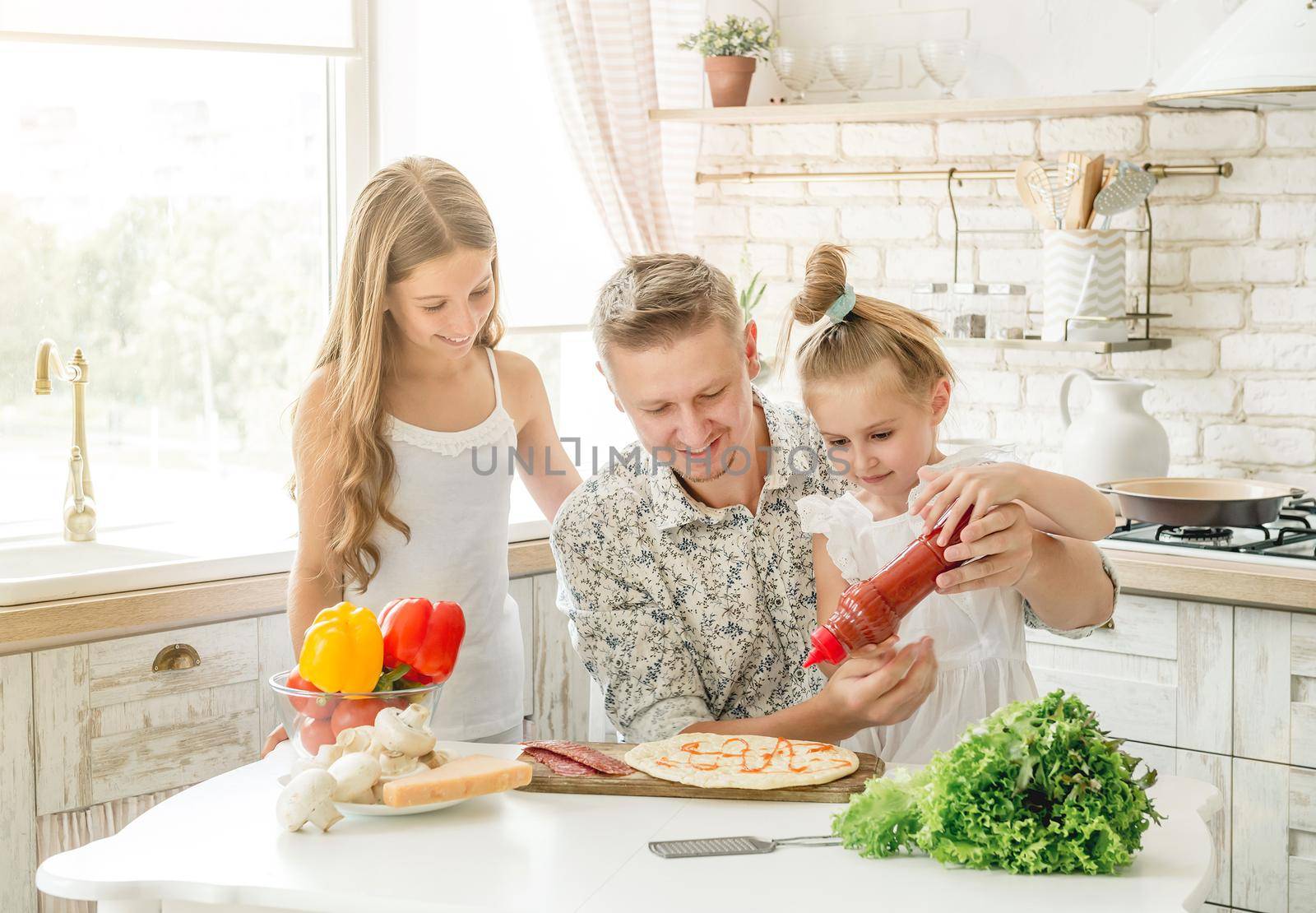 dad with daughters preparing pizza by tan4ikk1