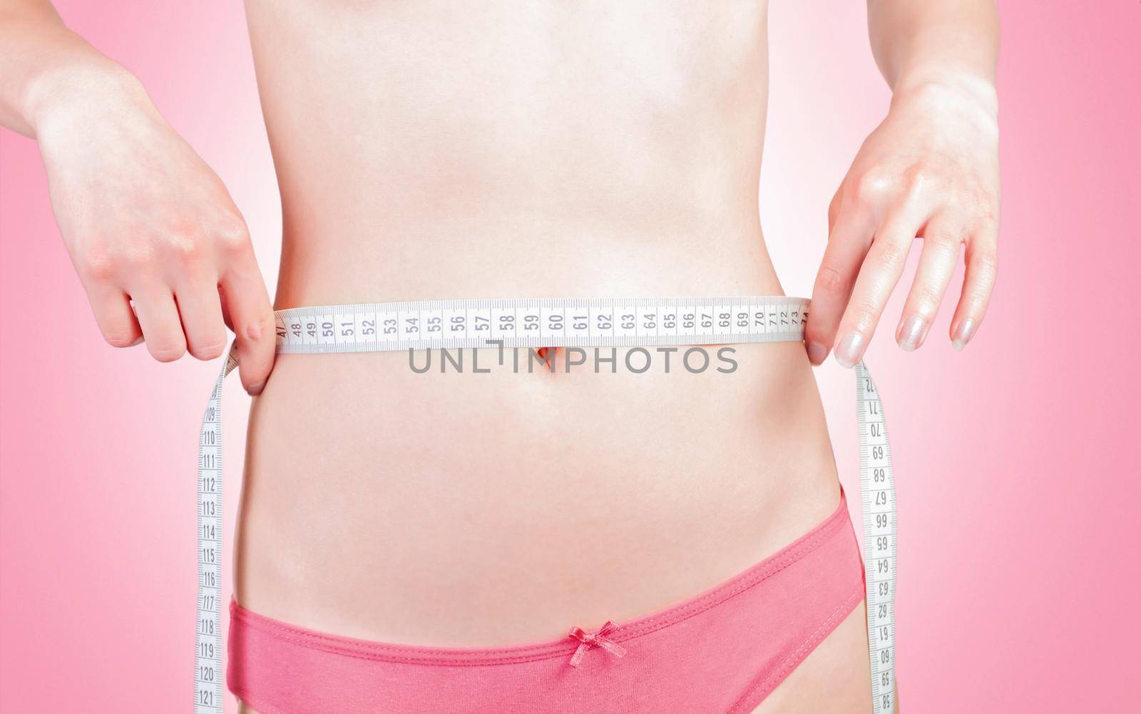 young woman measuring body