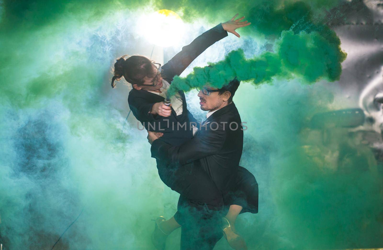 Pasadoble, latin solo dance and contemporary dance - Handsome man and woman dancing into smoke cloud. by Satura86