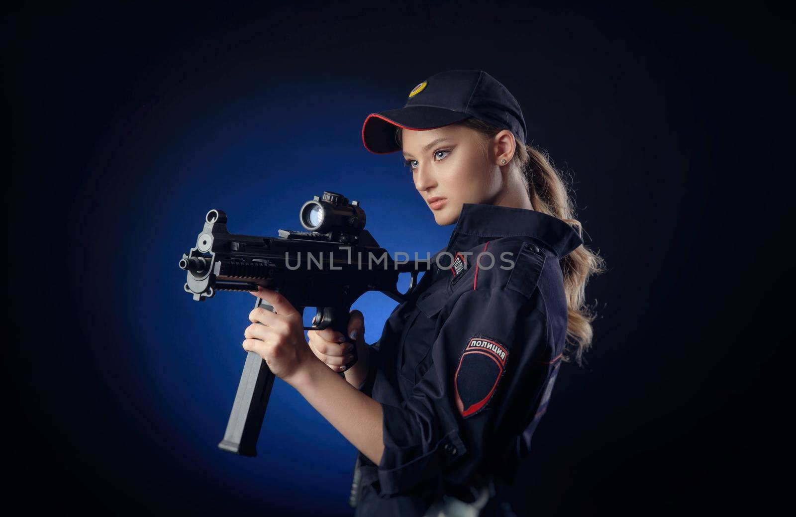 the girl in the police uniform with a gun is a Russian policeman with gun. English translation of Police by Rotozey