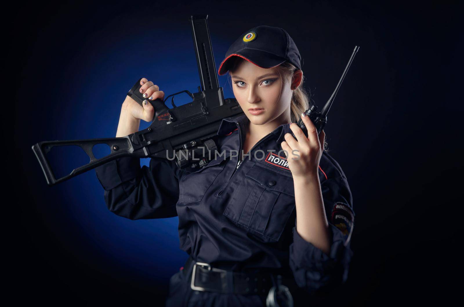 the girl in the police uniform with a gun is a Russian policeman with gun. English translation of Police by Rotozey