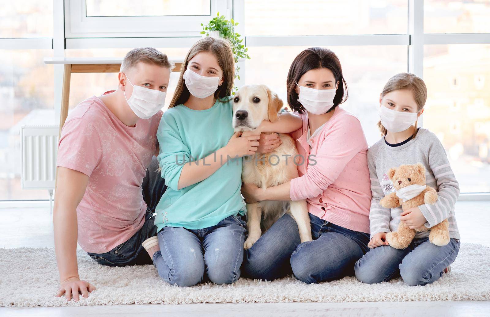 Beautiful family in medical masks by tan4ikk1