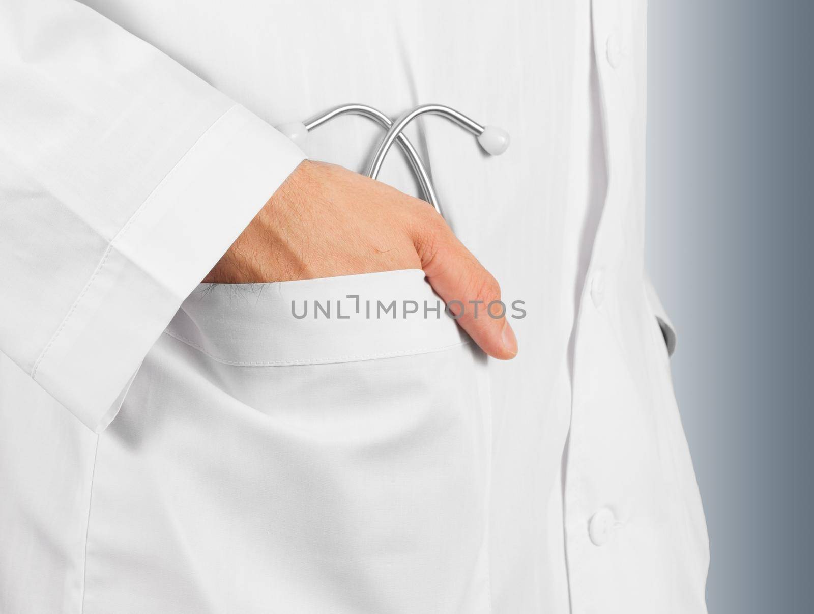 Man's doctor hand with a stethoscope in the pocket , close-up