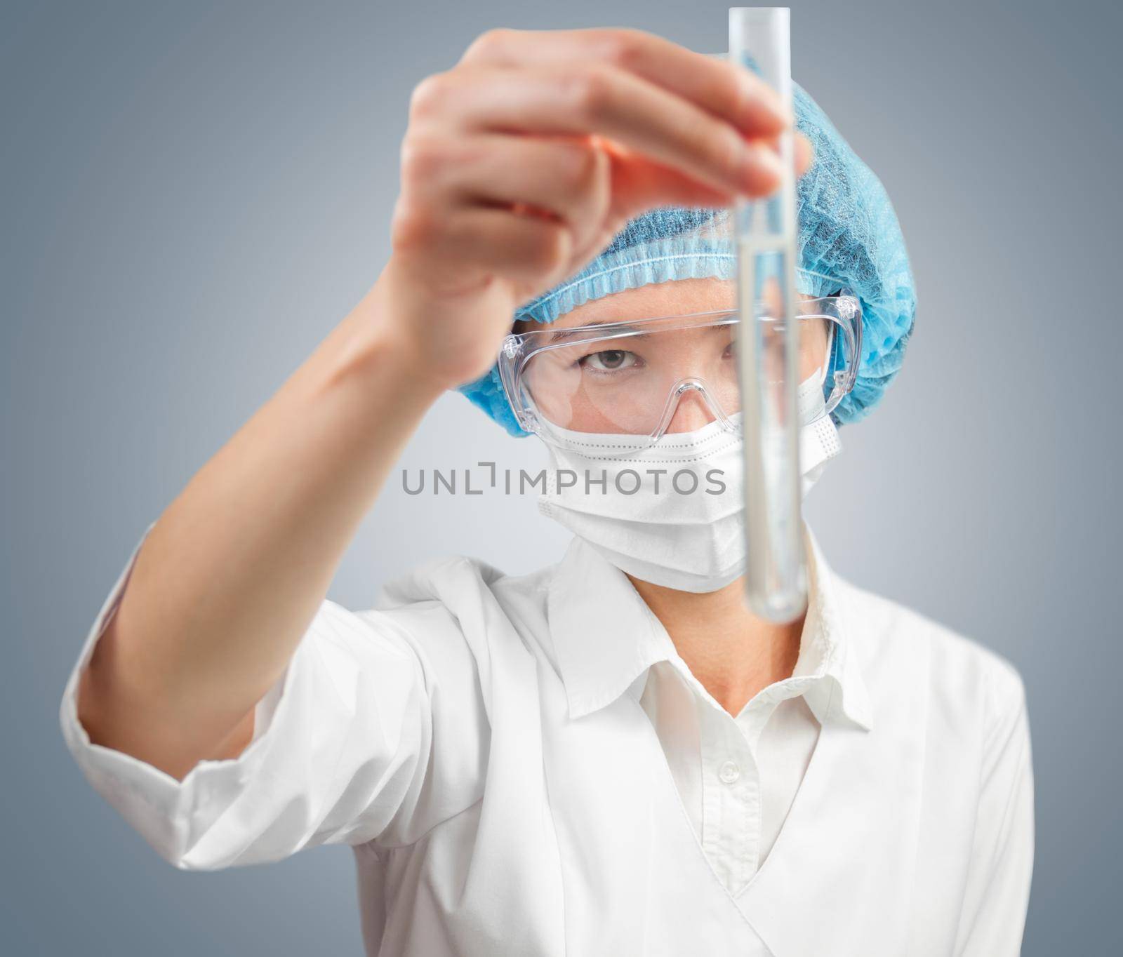 Laboratory female technician looks at successful outcome of research