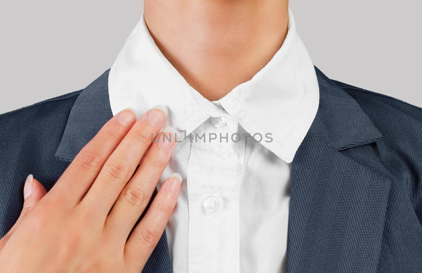 Unrecognizable female office worker holds white collar, close-up