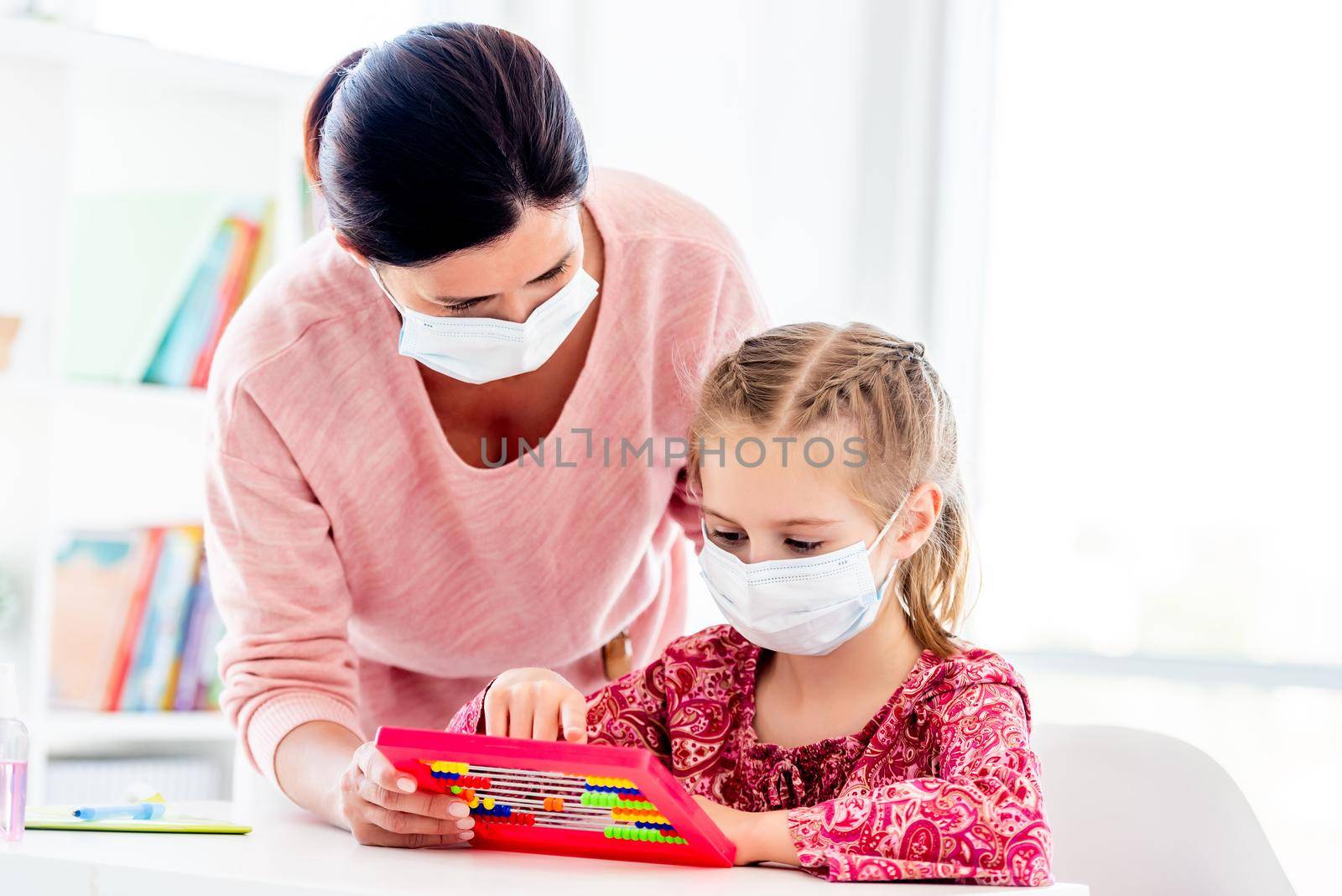 Teacher and schoolgirl in protective masks by tan4ikk1