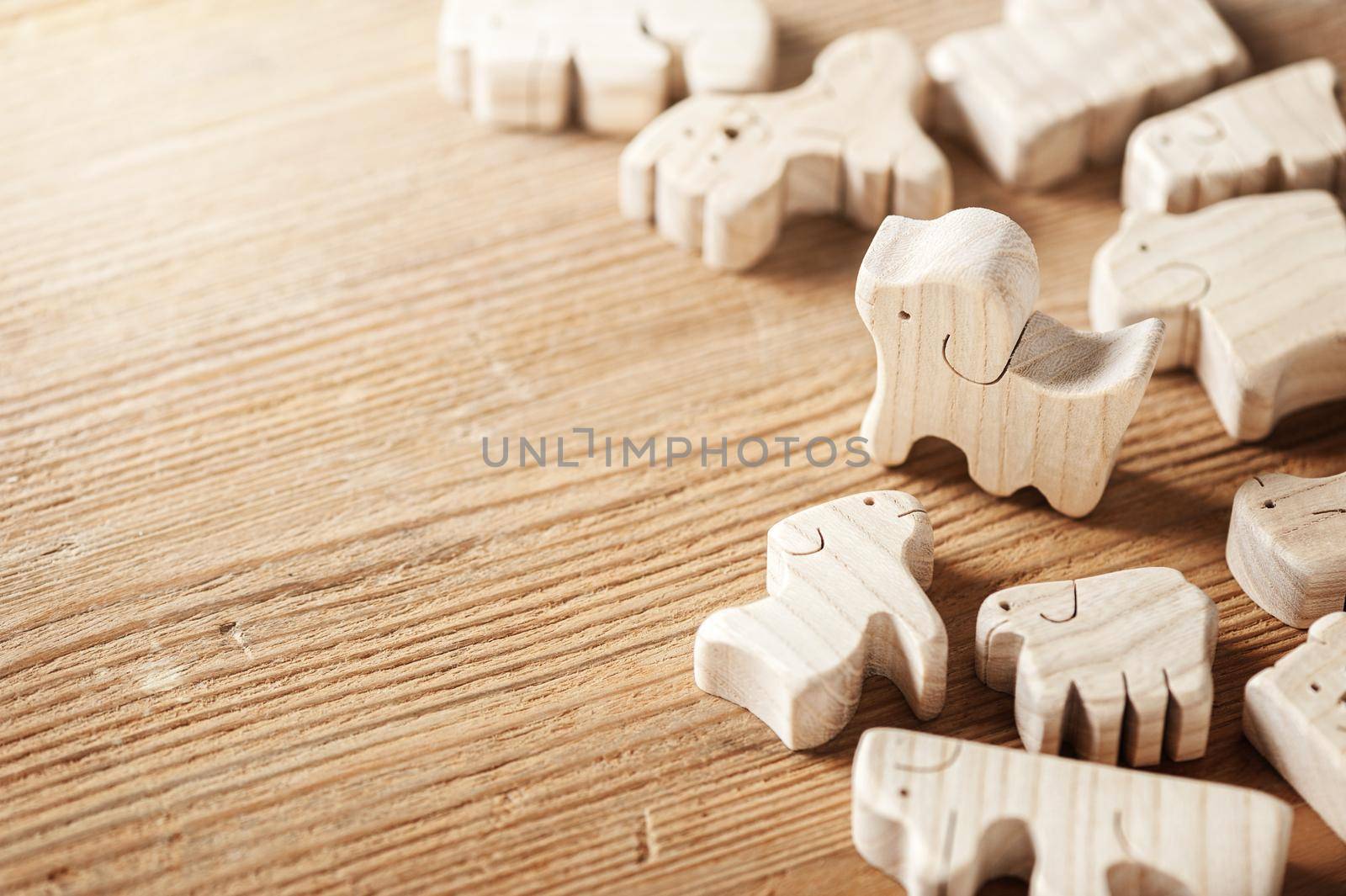 toys background, cute wooden toy animal on wood board, tiny toys and shallow depth of field