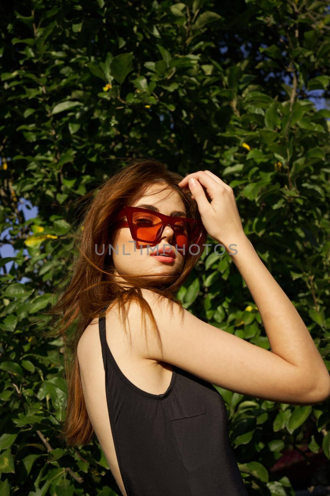 pretty woman wearing sunglasses green leaves summer model by Vichizh