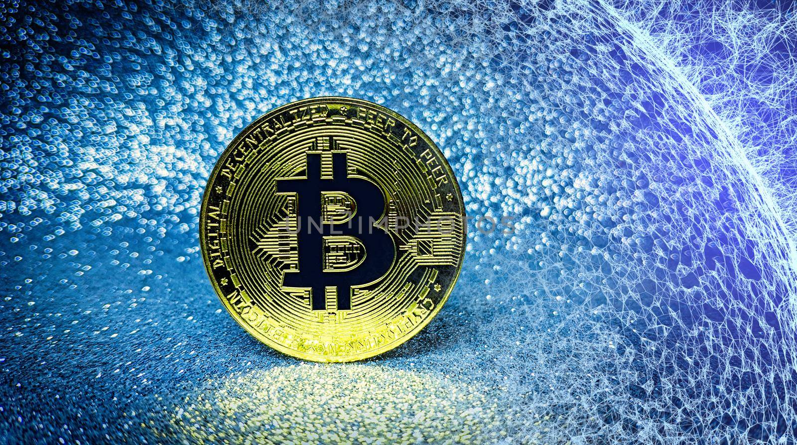 Bitcoin gold coin and defocused glitter background