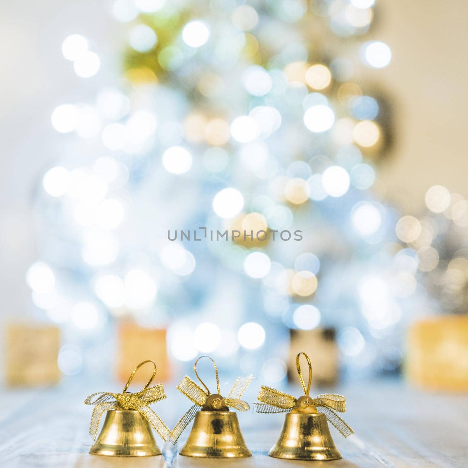 decorative bells near christmas tree