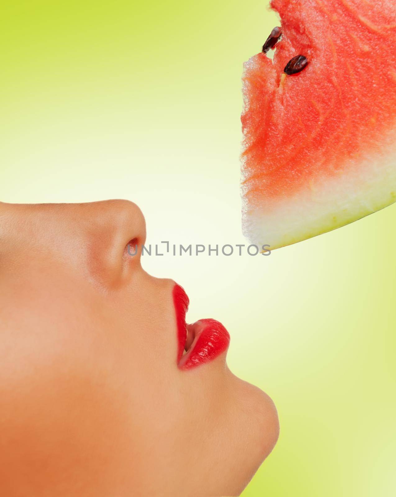 Close-up image of a red lips and a piece of watermelon