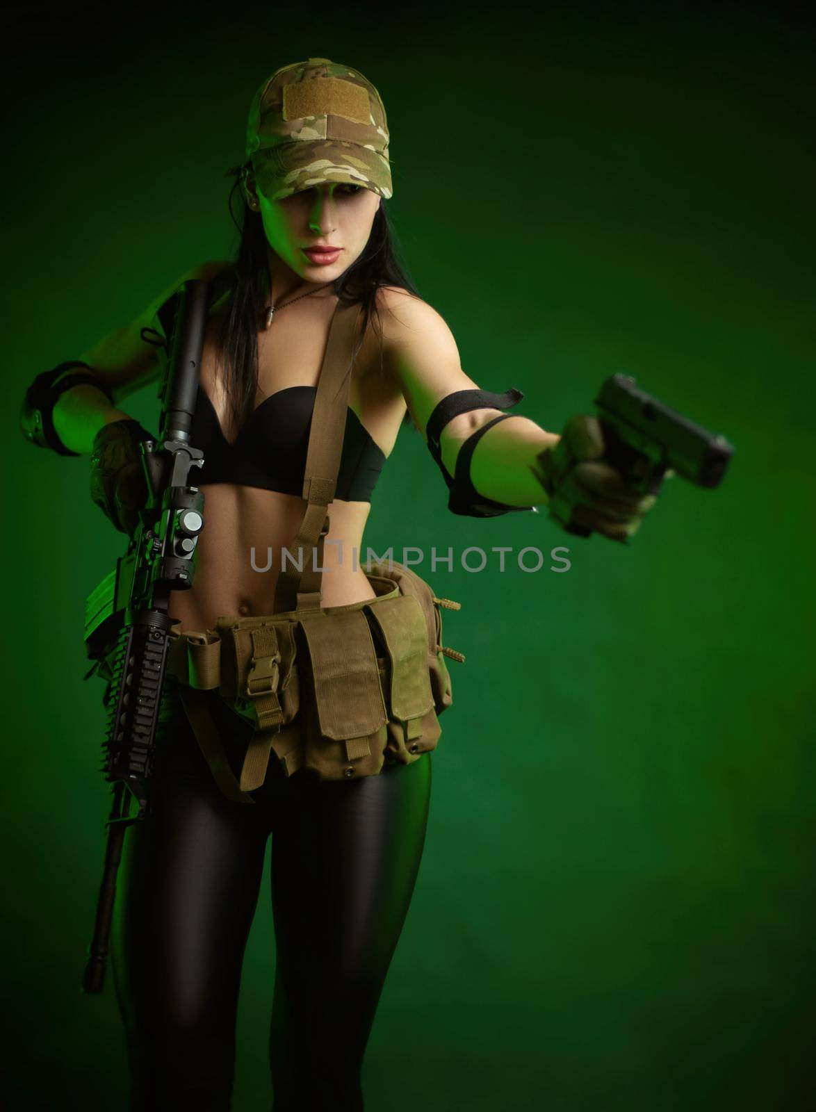 slender woman in military fatigues with an American automatic rifle on a green background by Rotozey