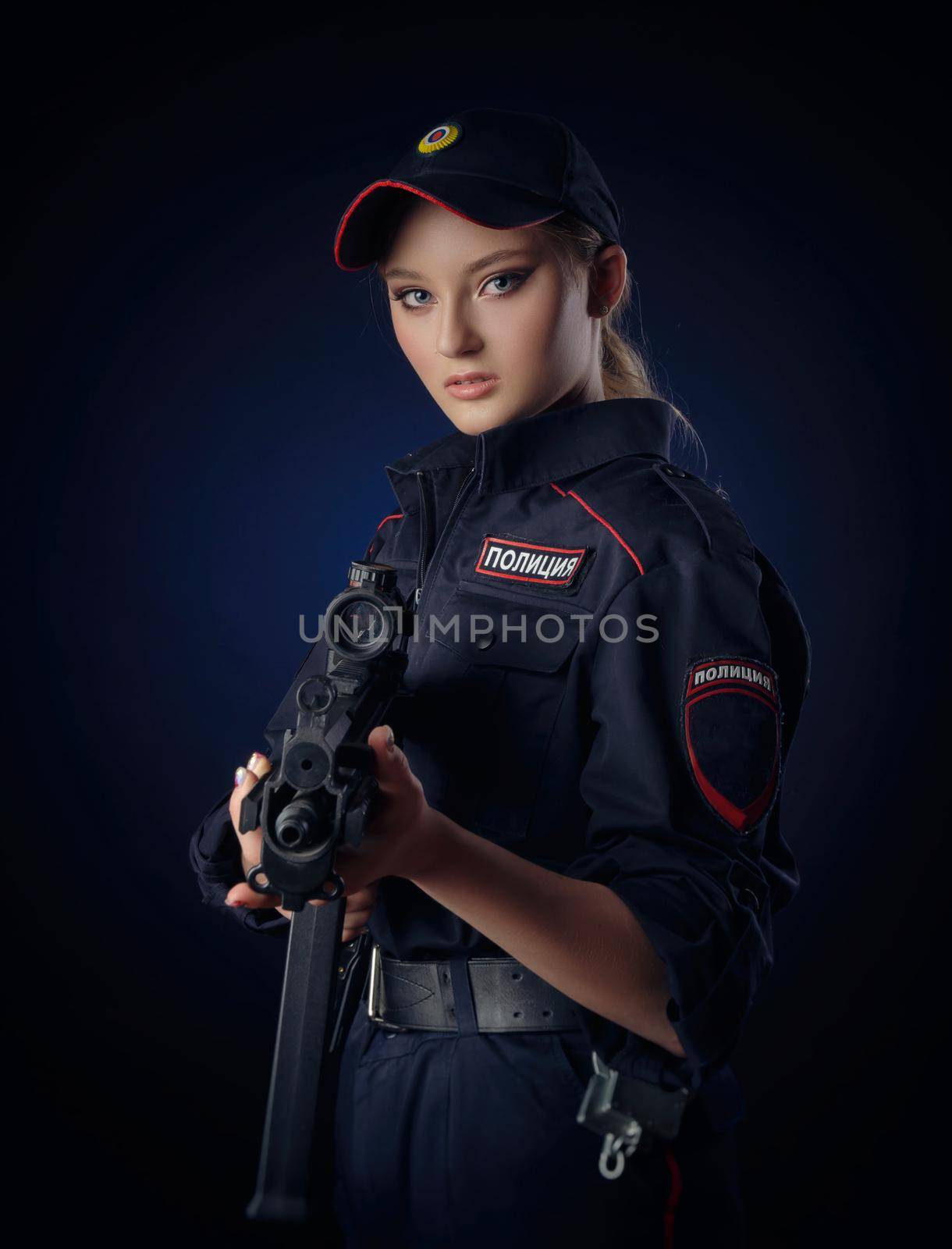 girl in the police uniform with a gun is a Russian policeman. English translation of Police