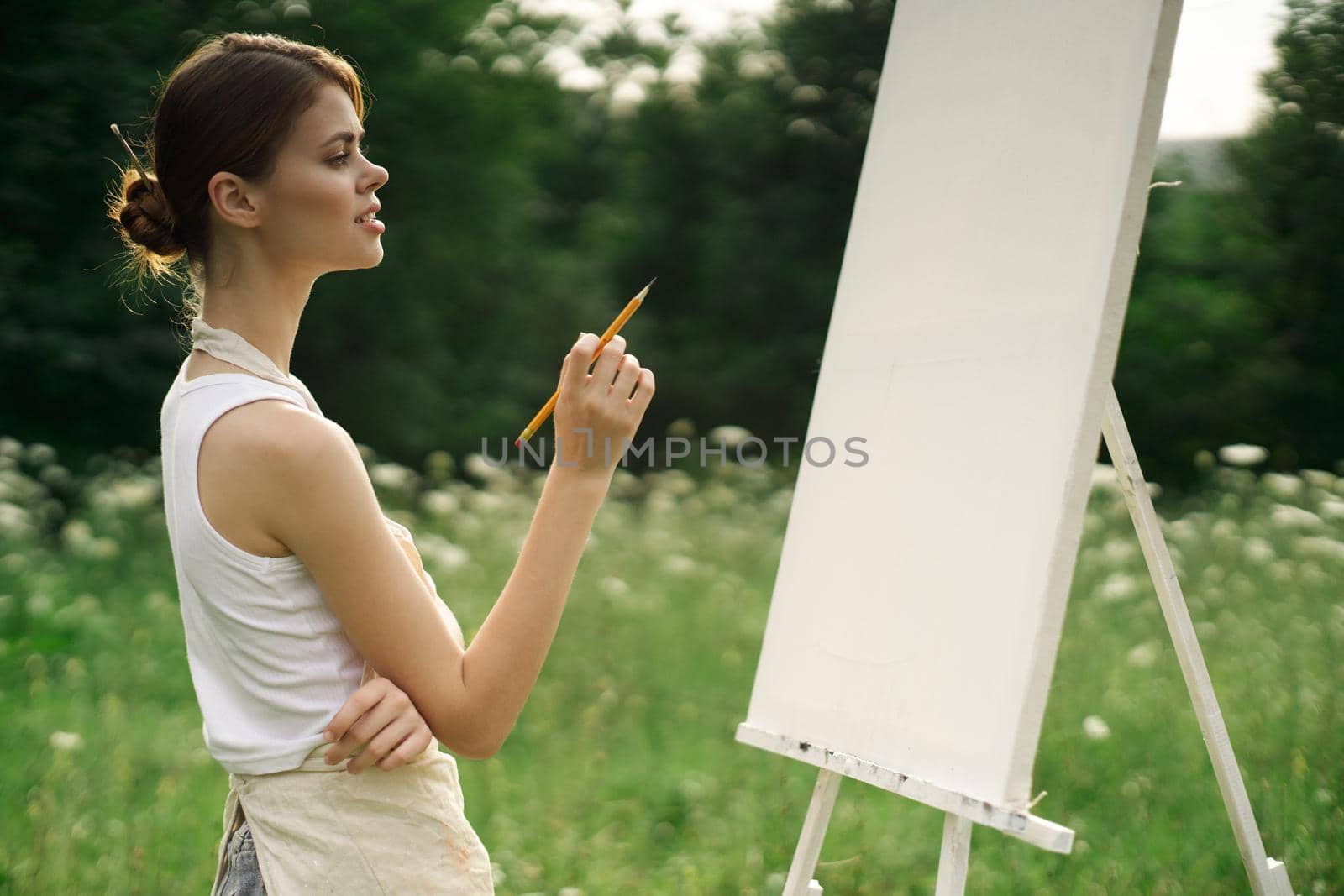 woman artist nature drawing landscape art hobby. High quality photo