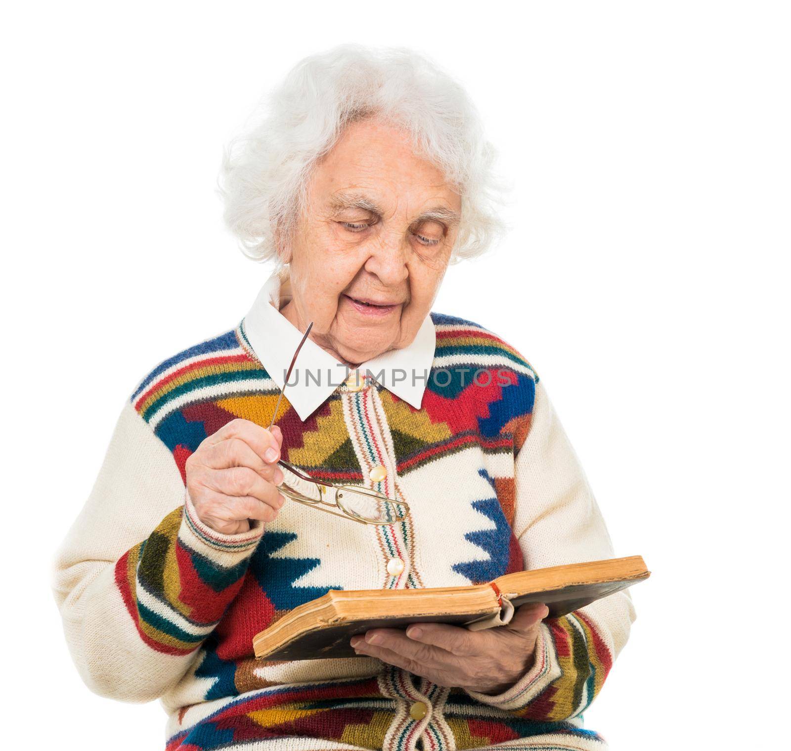 elderly woman flipping an old book isoalted on white background