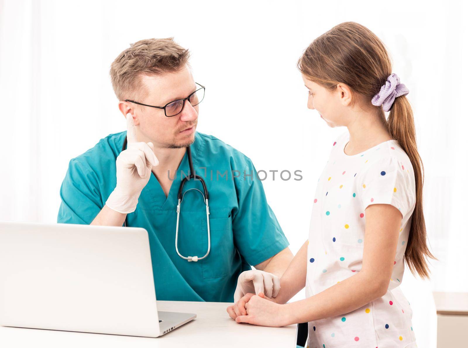 Skilled doctor doing some optic tests with patient teen, isolated on white background