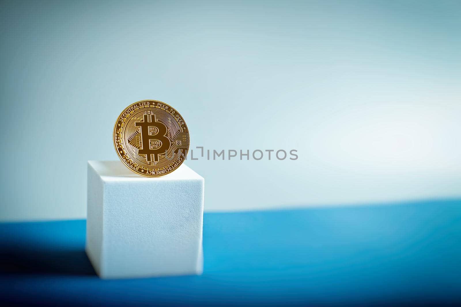 Bitcoin gold coin and defocused chart background. by Maximusnd
