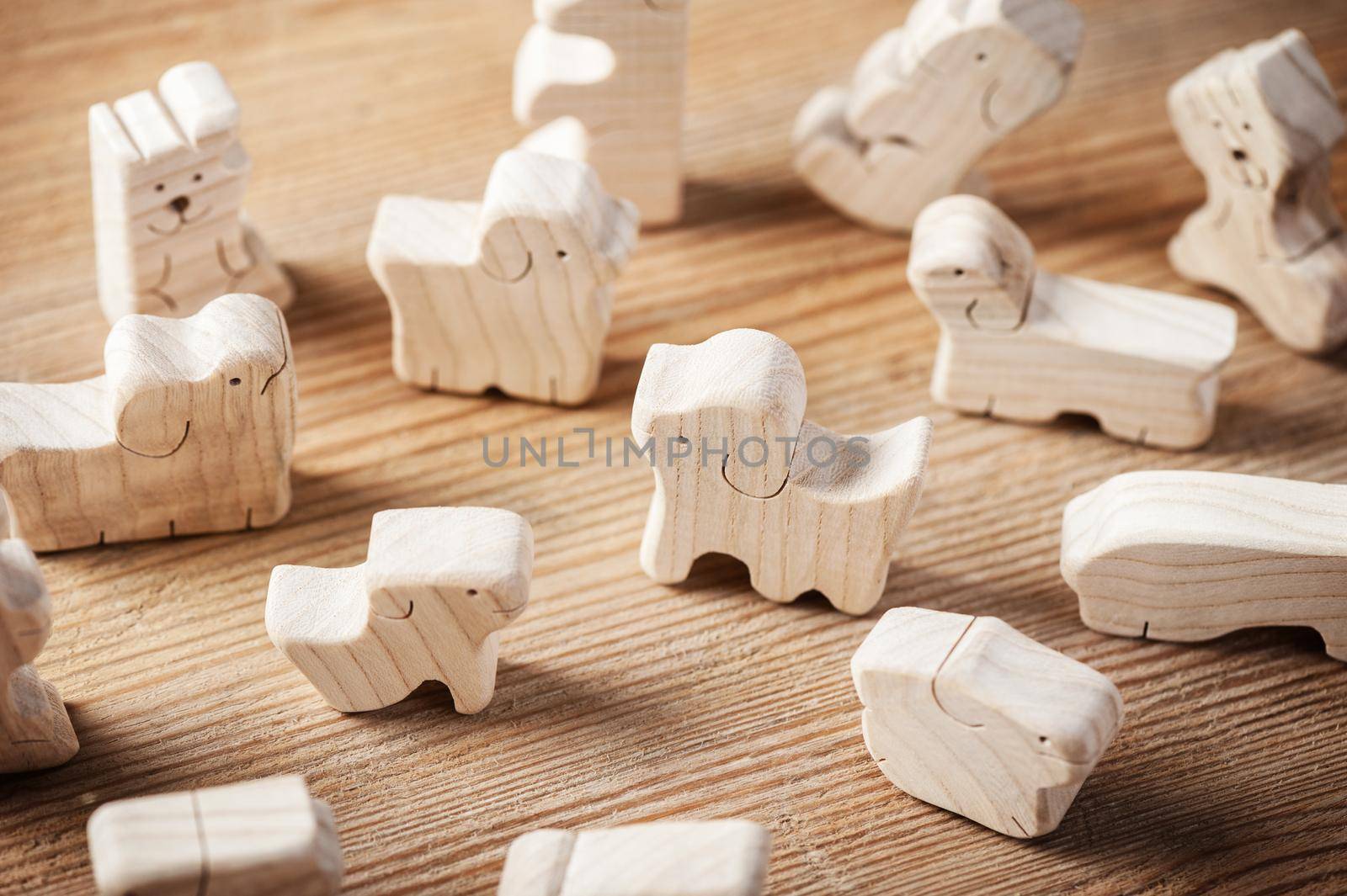 cute wooden toy animal on wood board, tiny toys and shallow depth of field