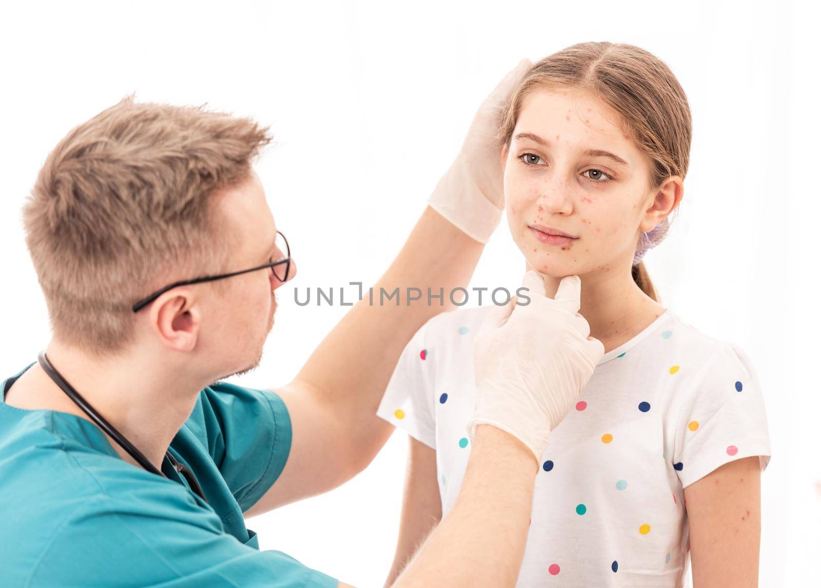 Qualified medic accurately checking sick girls appearance, on white background