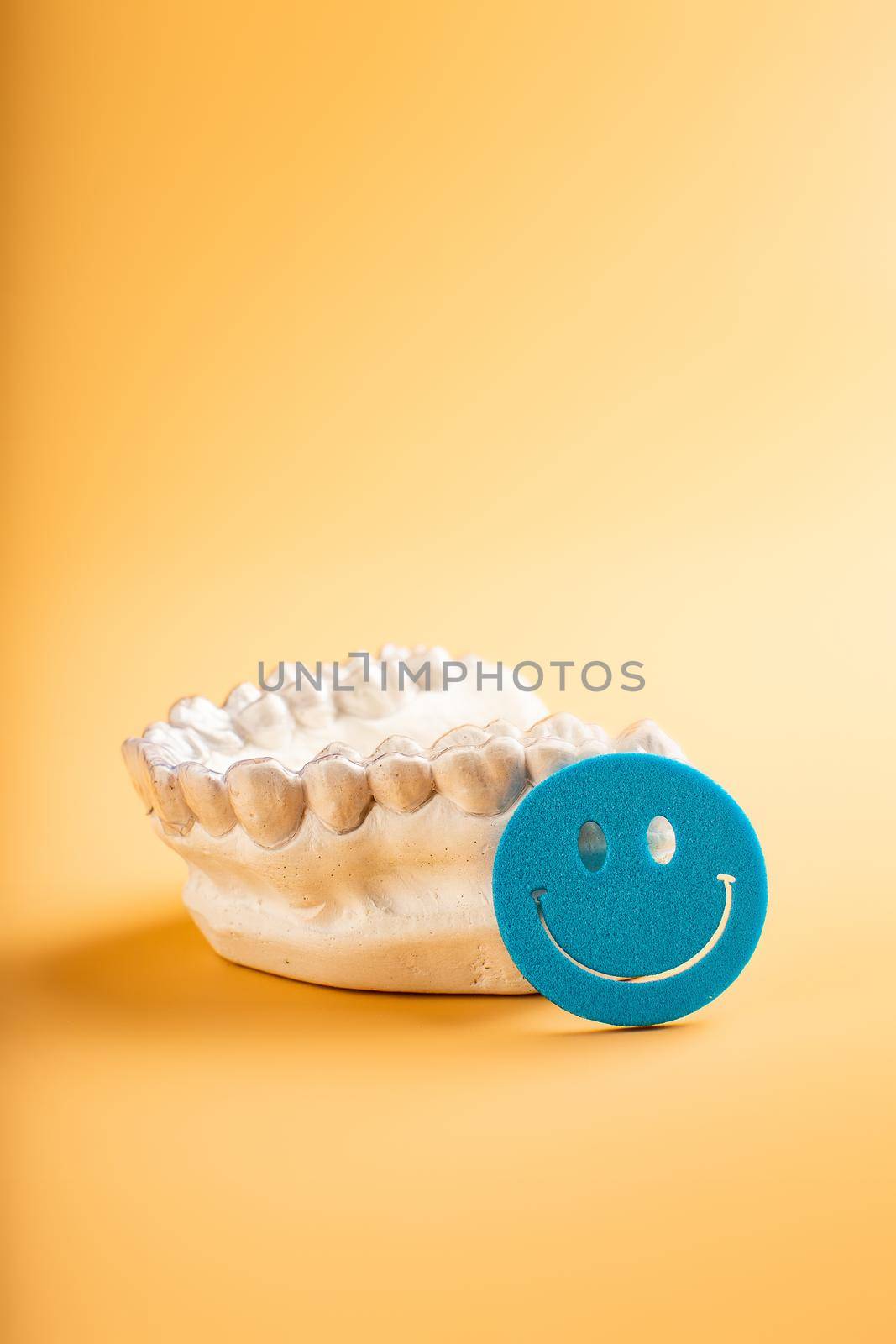 Close-up individual tooth tray Orthodontic dental theme. In hand Invisible braces