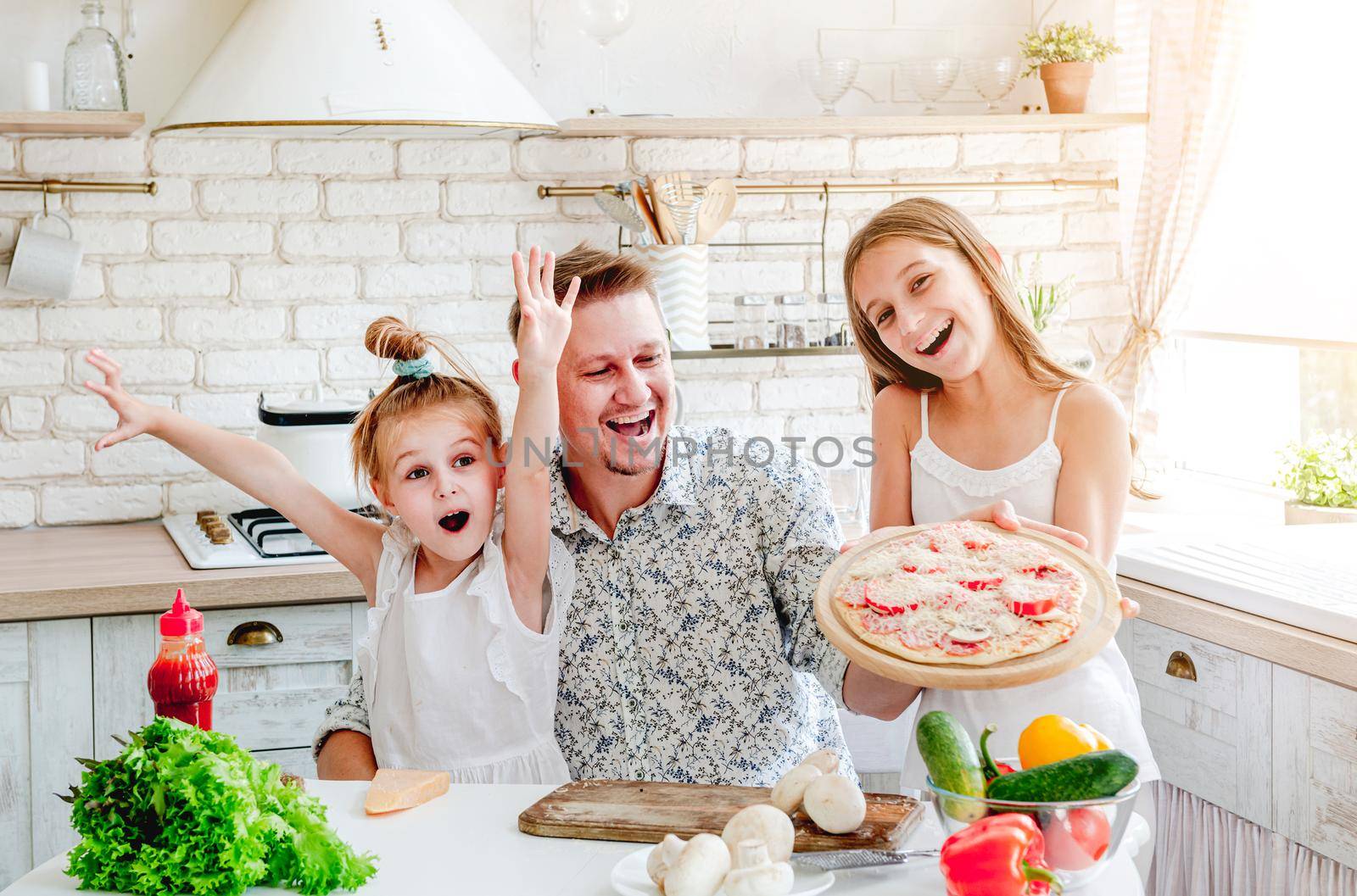 dad with daughters preparing pizza by tan4ikk1