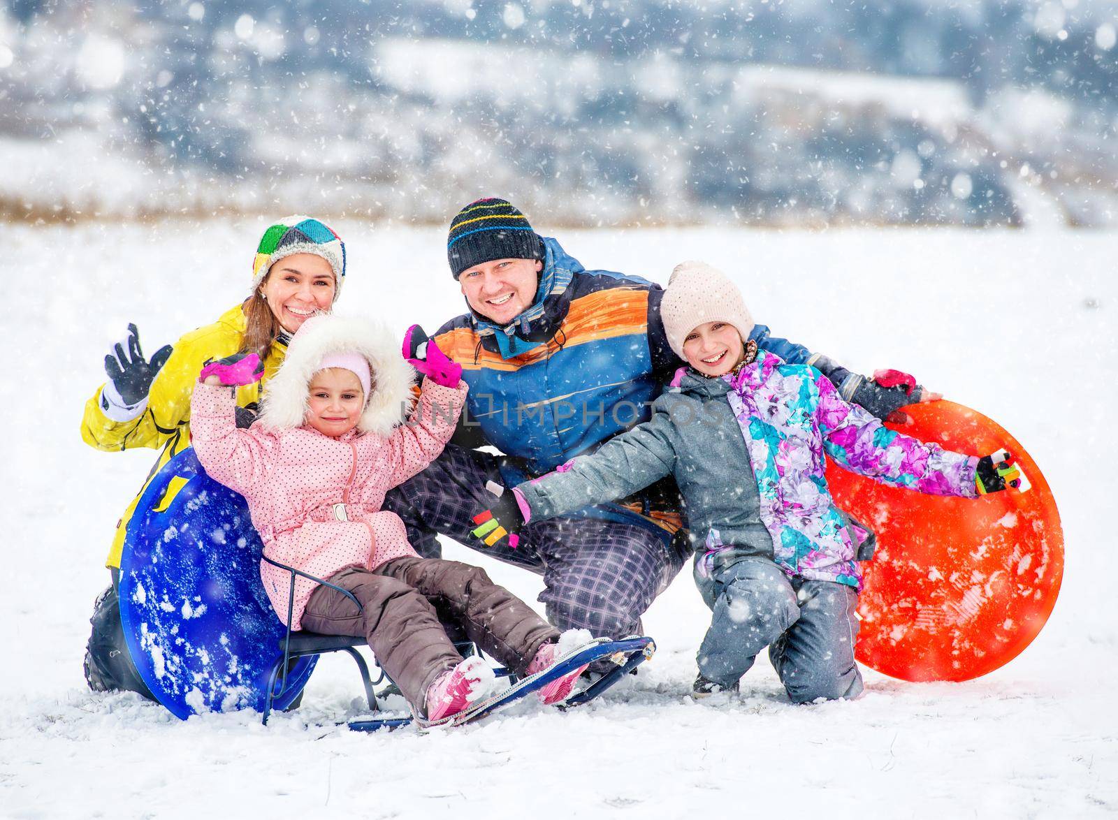 Happy family portrait outdoors at winter time by tan4ikk1