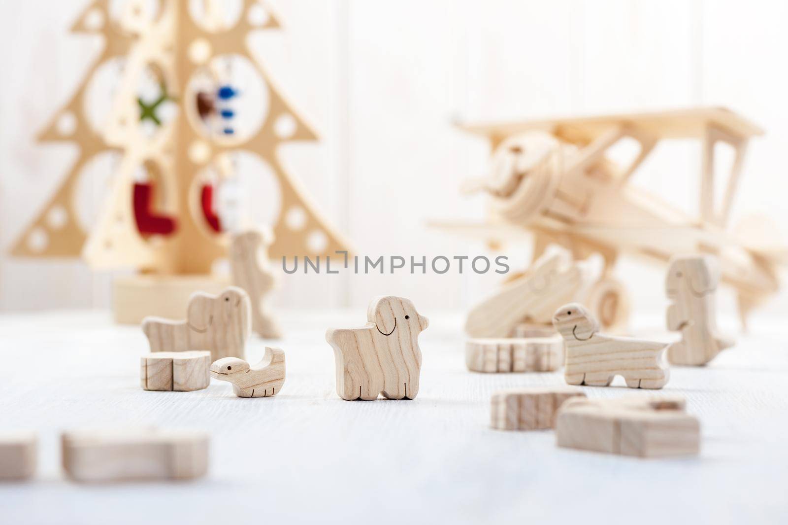 cute wooden toy animal on wood board, tiny toys and shallow depth of field