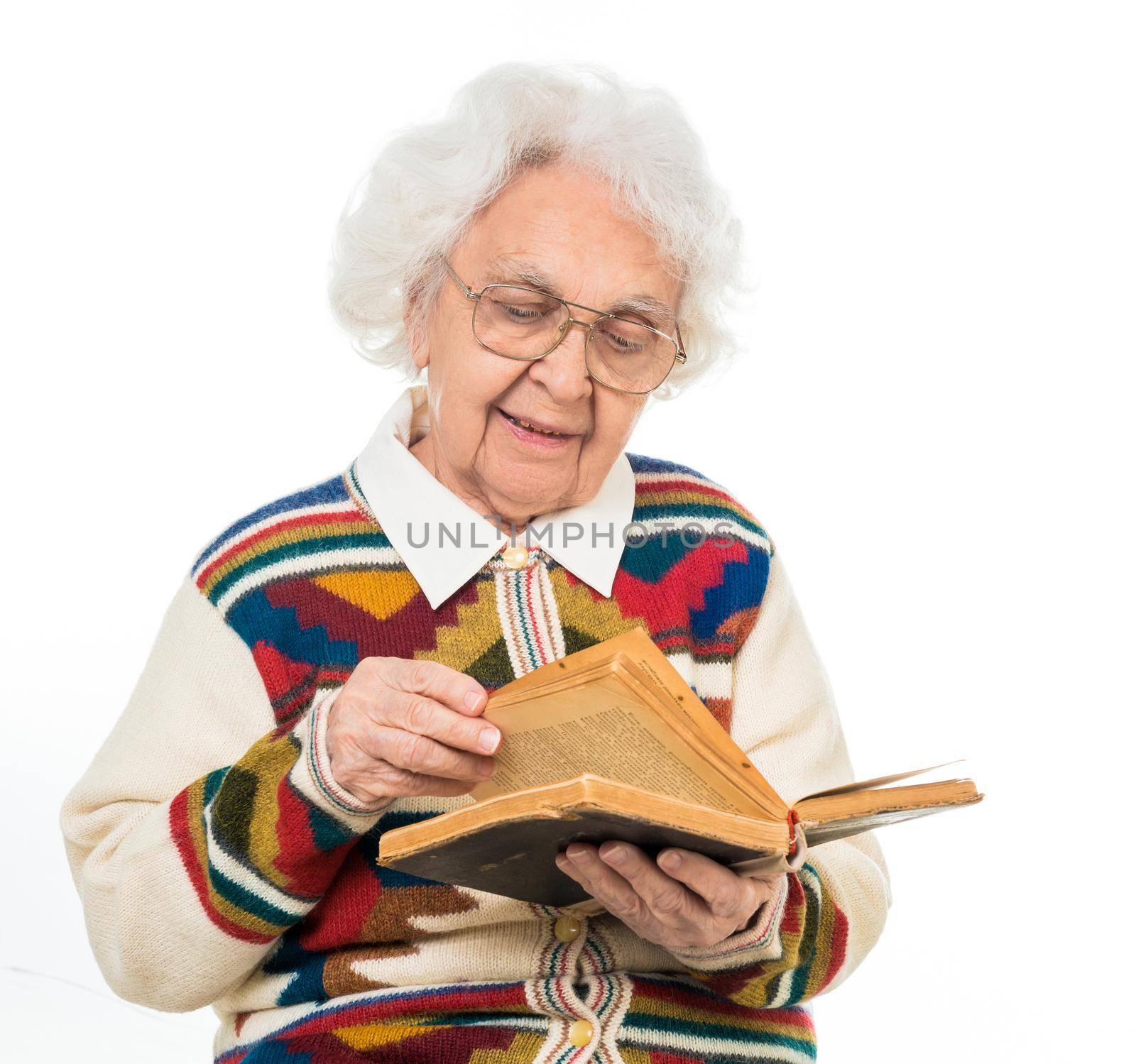 elderly woman flipping an old book isoalted on white background