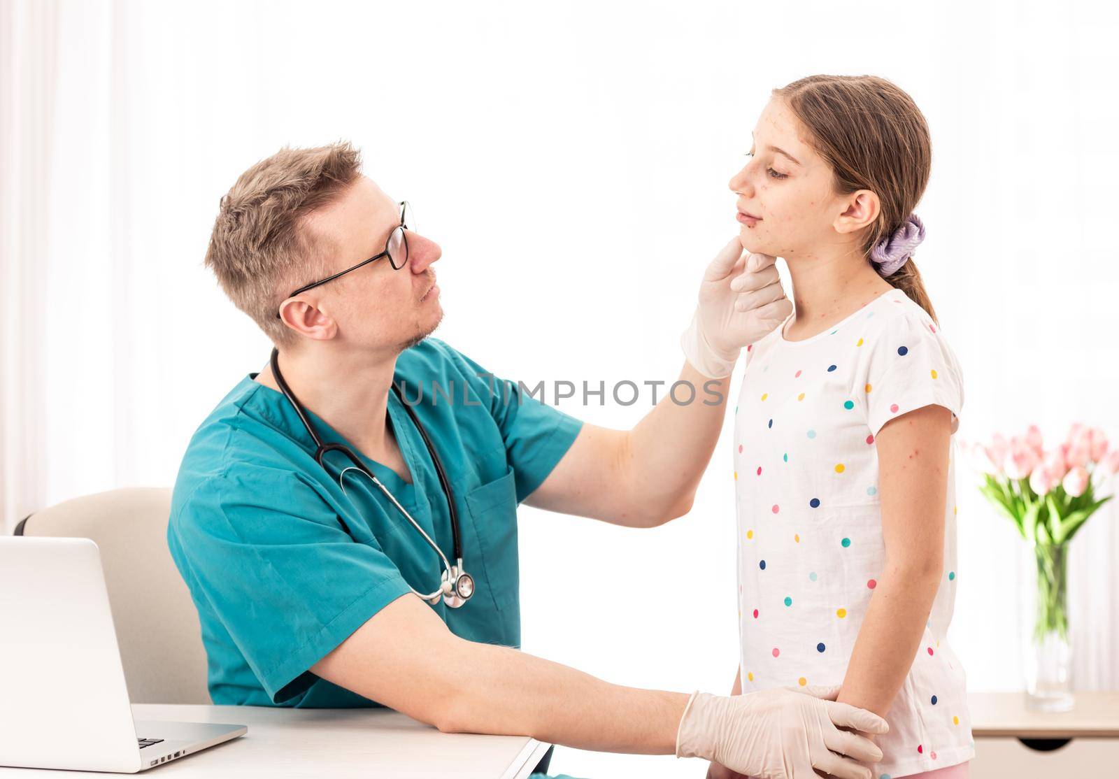 Qualified medic accurately checking sick girls appearance, on white background