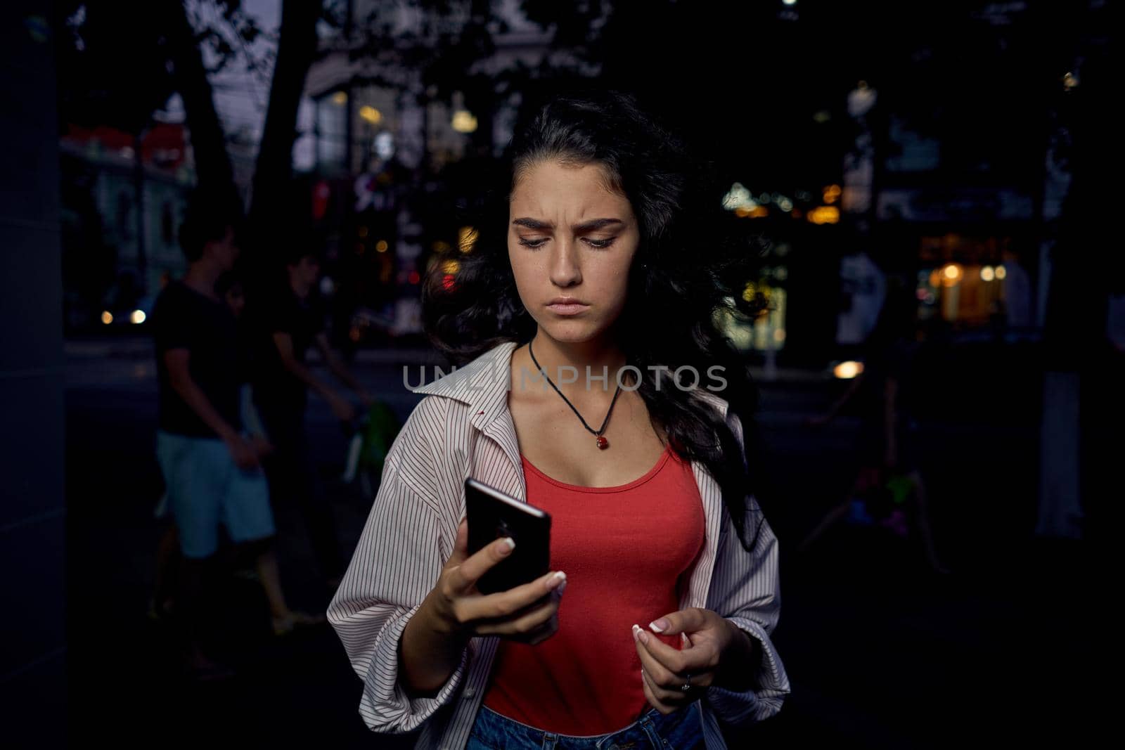 pretty woman with phone in hands communication walk lifestyle. High quality photo