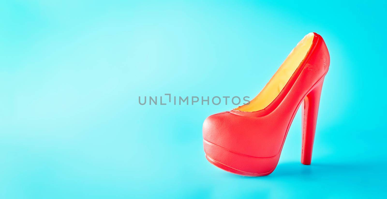 Chocolate women's shoes on a blue background.