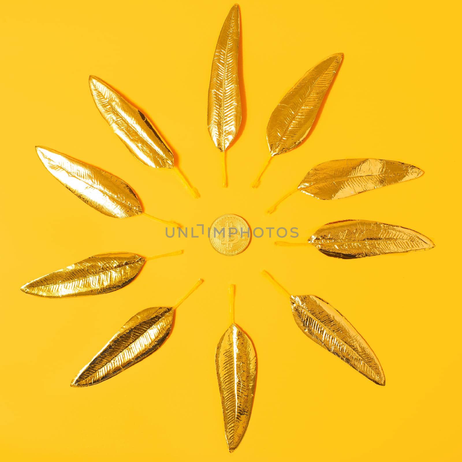 Creative concept of bitcoin in the form of a sun on a yellow background, future for cryptocurrency