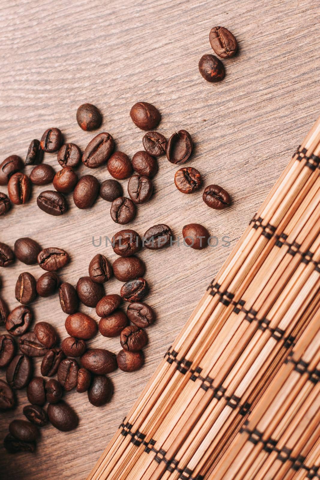 coffee beans Hot drink spilled grains wooden table. High quality photo