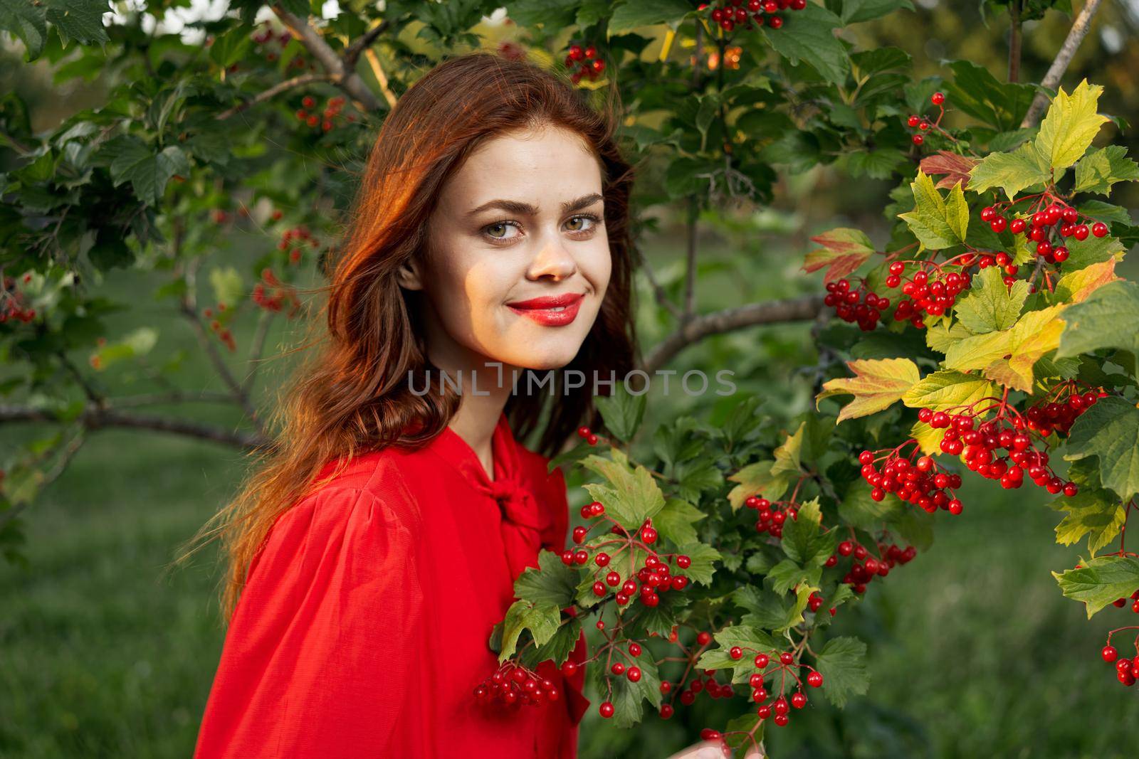 cheerful woman eating berries outdoors fresh air. High quality photo