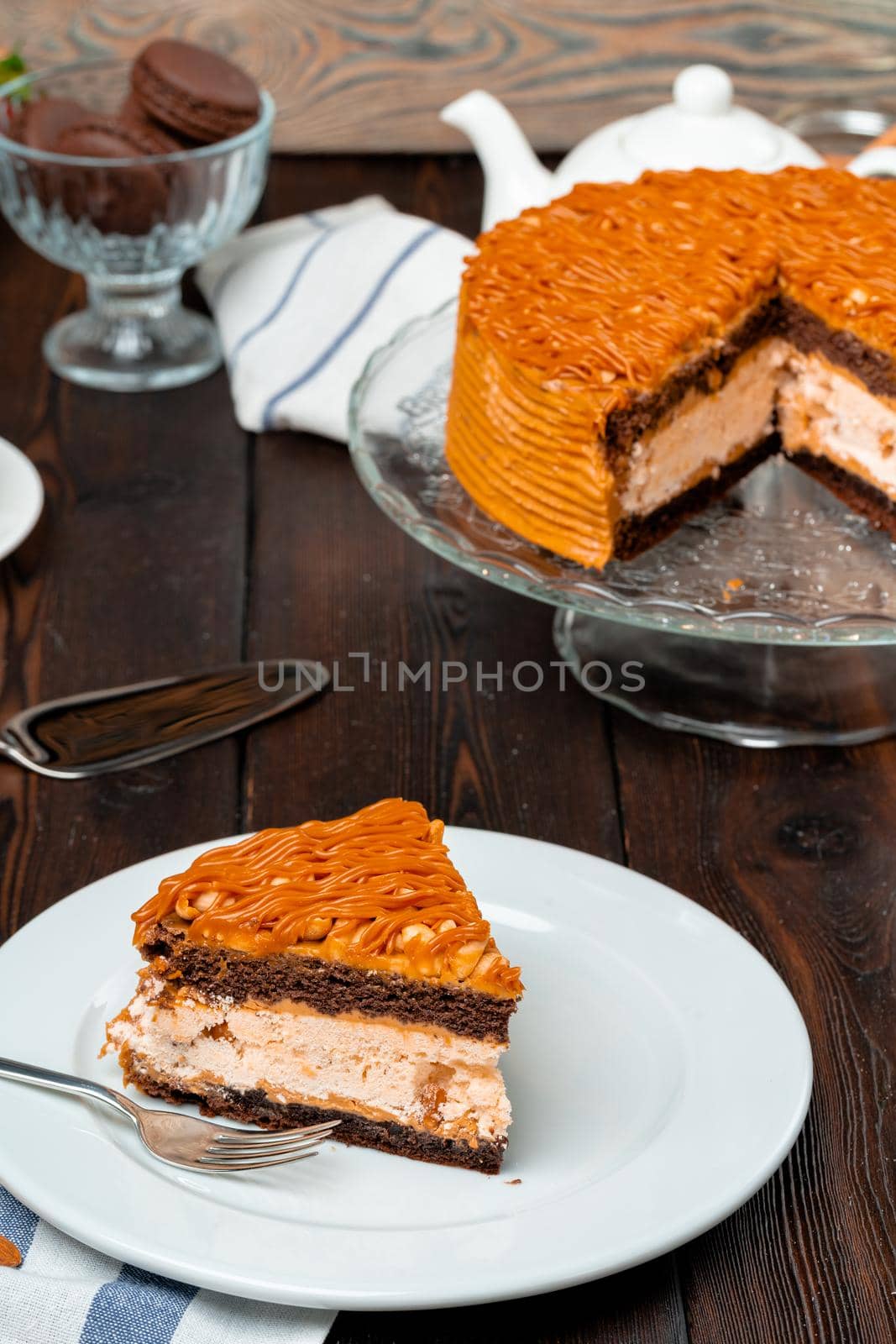 Plate with delicious caramel cake close up by Fabrikasimf