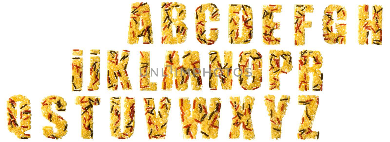 Pile of spaghetti forming a letters, all different shapes, colors and varieties isolated on a white background