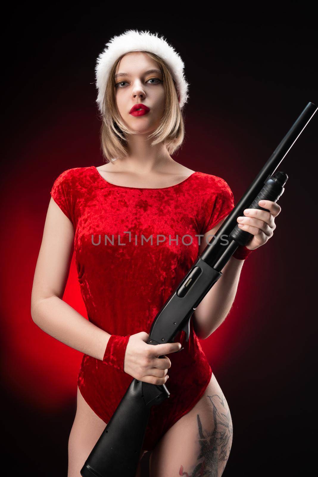 a girl in a red bodysuit and a Santa Claus hat with a shotgun in her hands for Christmas by Rotozey