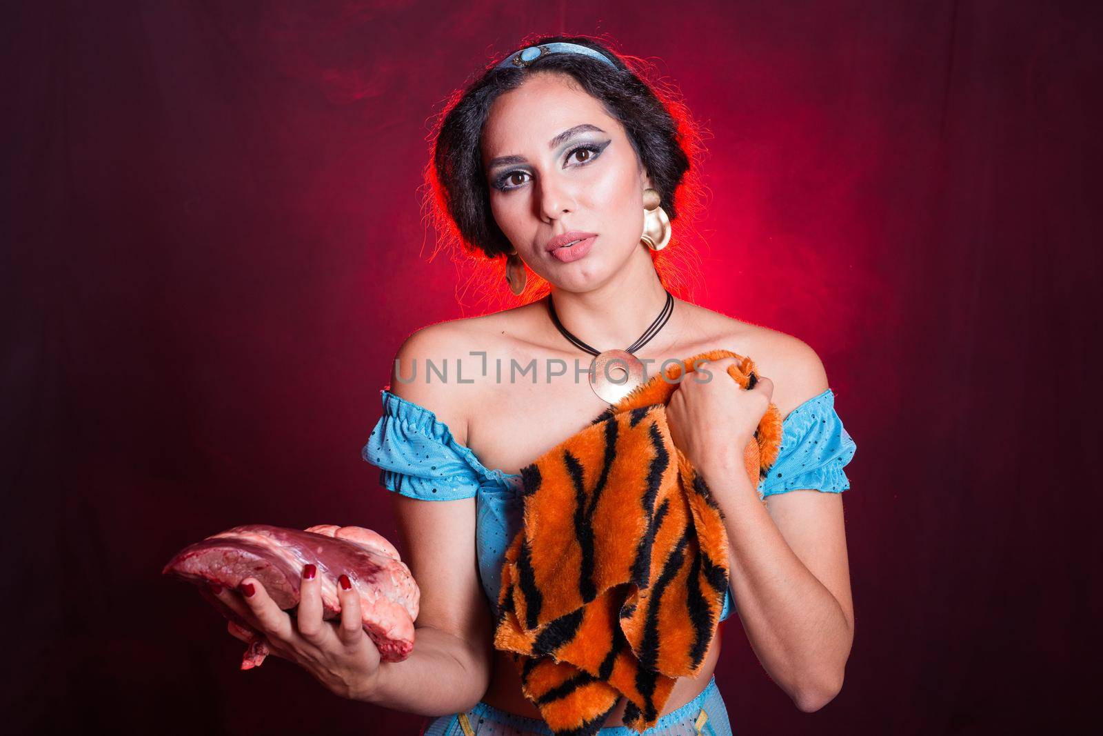 Stop animal killing concept - Pretty girl show animal skin and raw meat that she wants to tell someone don't kill animals or stopped violence against animal. by Satura86