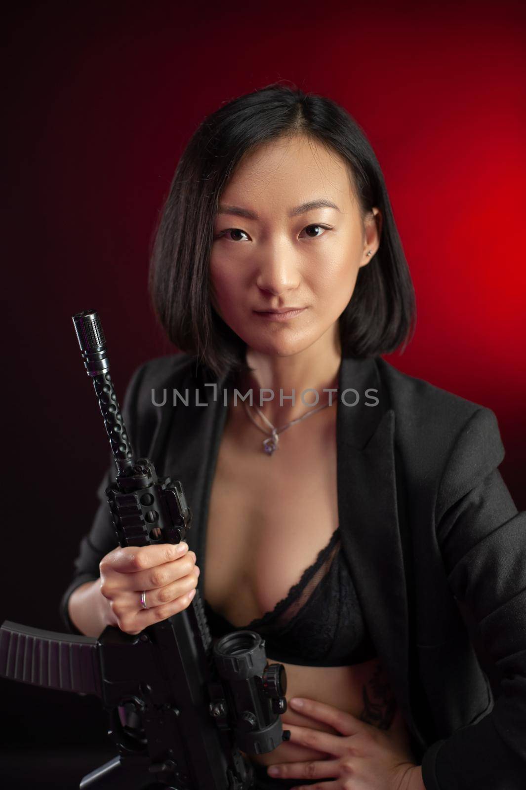 asian woman in a jacket with an automatic rifle in her hands mafia fighter by Rotozey