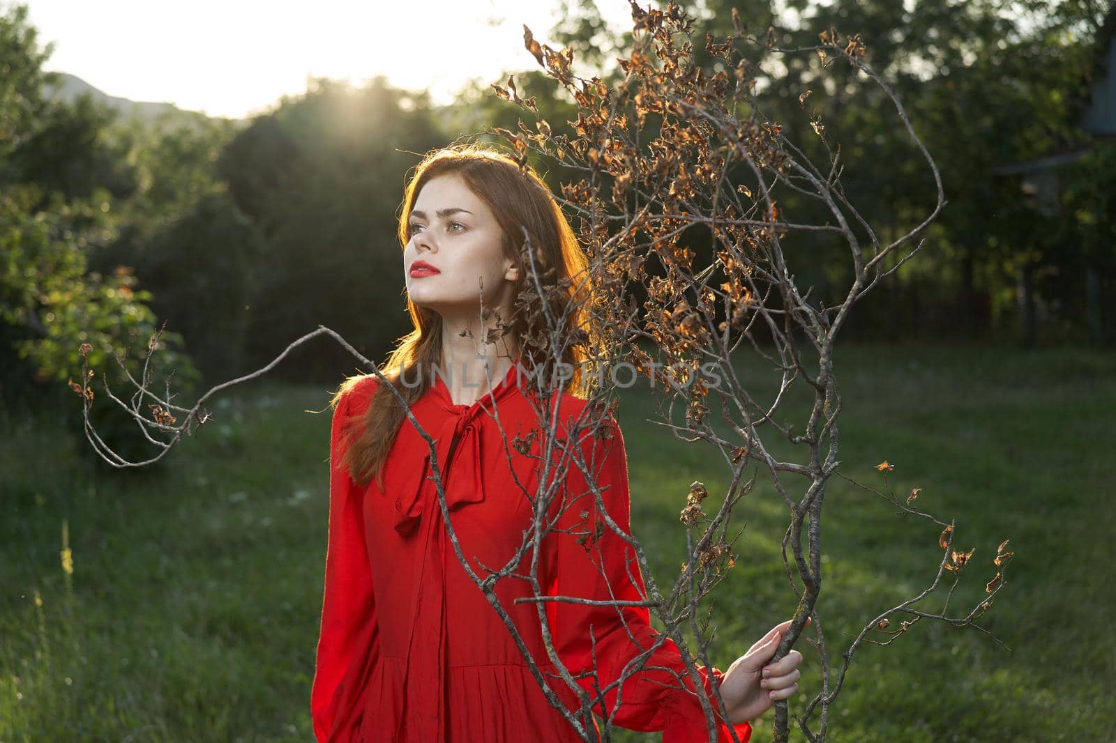 attractive woman in red dress outdoors fresh air summer by Vichizh