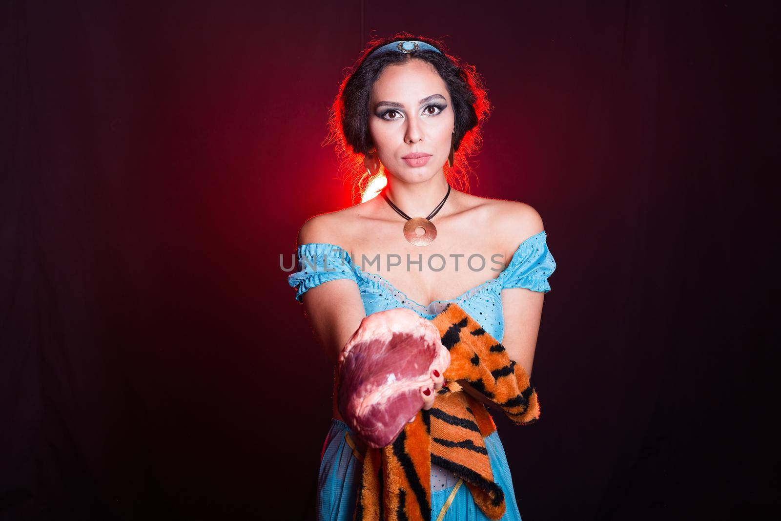 Stop animal killing concept - Pretty girl show animal skin and raw meat that she wants to tell someone don't kill animals or stopped violence against animal. by Satura86