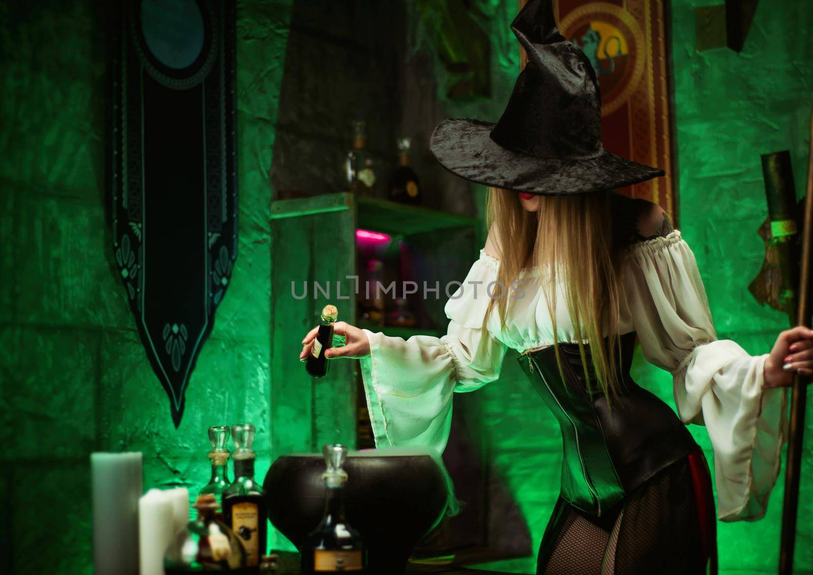 women in a hat in the witch's room on Halloween by Rotozey