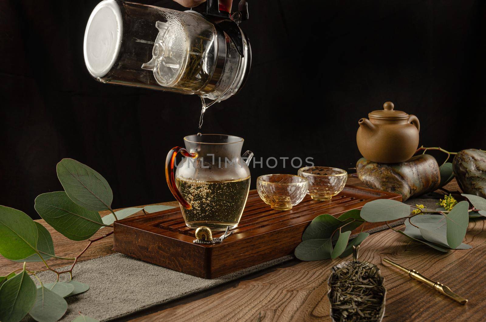 tea table with instruments teapots cups and tea Shen Puer by Rotozey