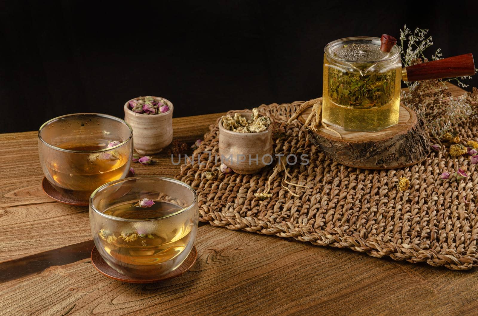 table with herbal tea and rose petals by Rotozey