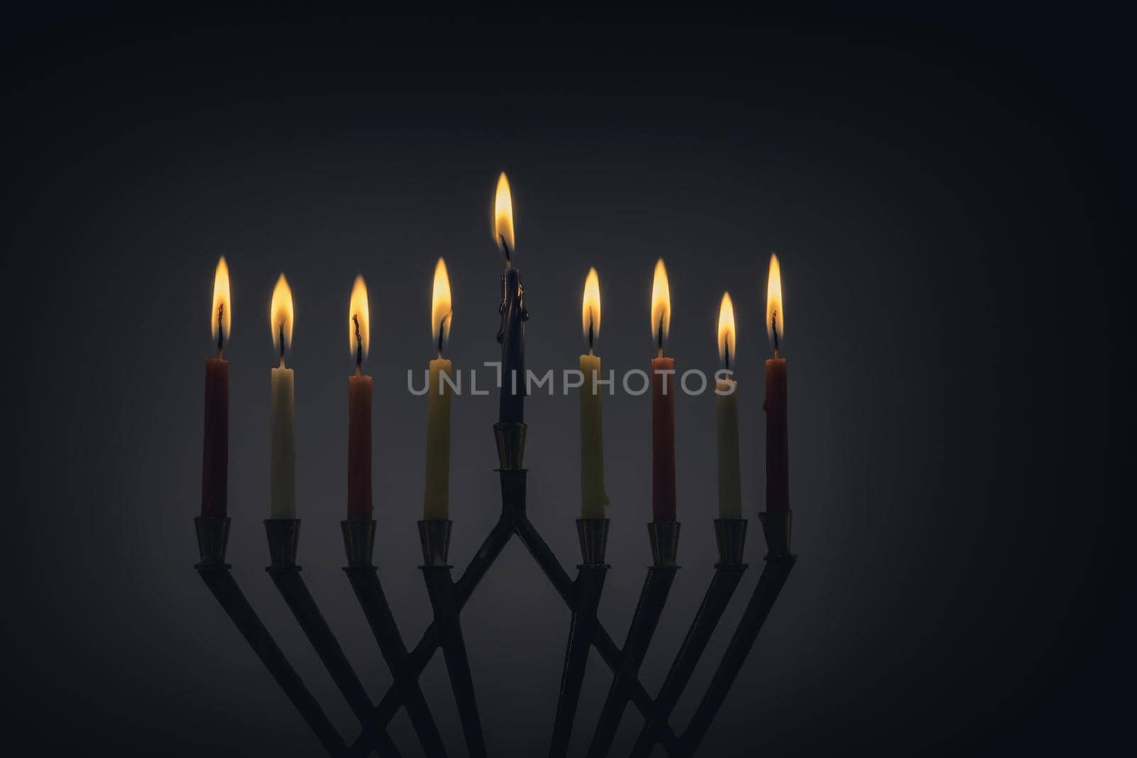 Candles lit for night of hanukkah menorah with burning candles for holiday