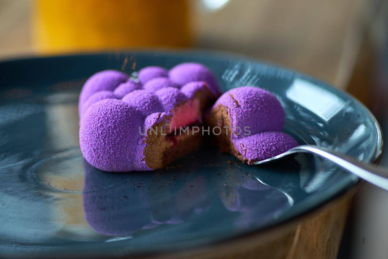 French Mousse Mini Desserts with Purple Velvet Cover on the table, serving in a restaurant, menu food concept.