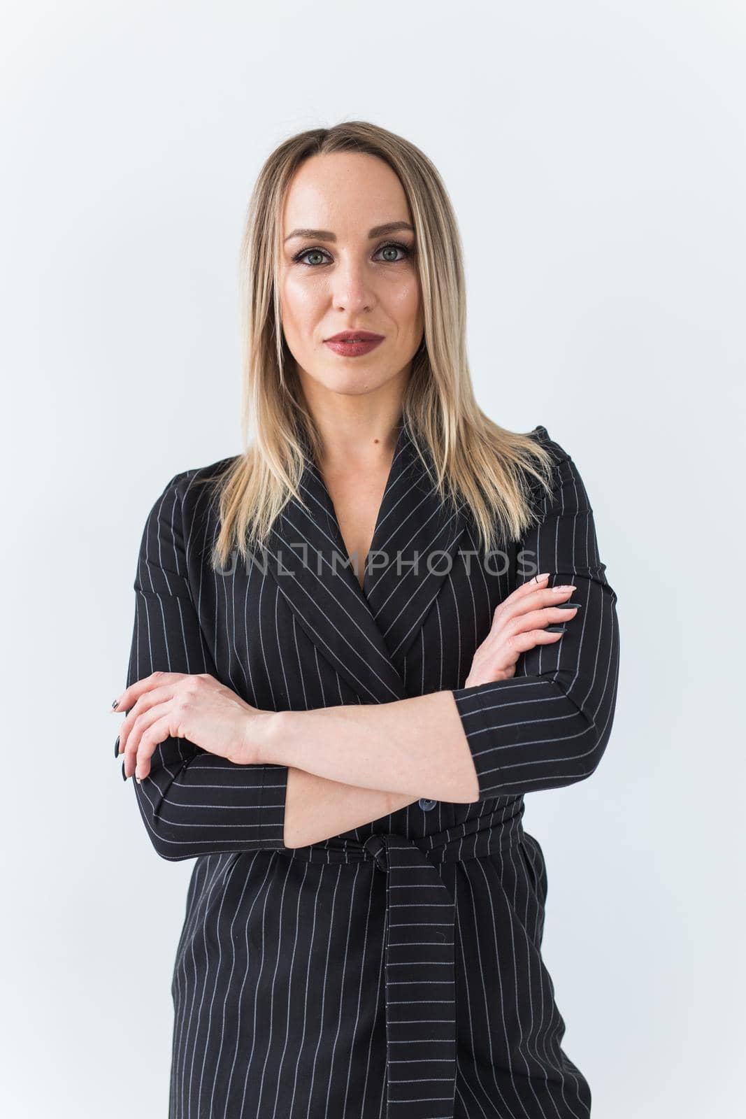 Fashion concept - Portrait of sexy business woman in a suit on white background. by Satura86