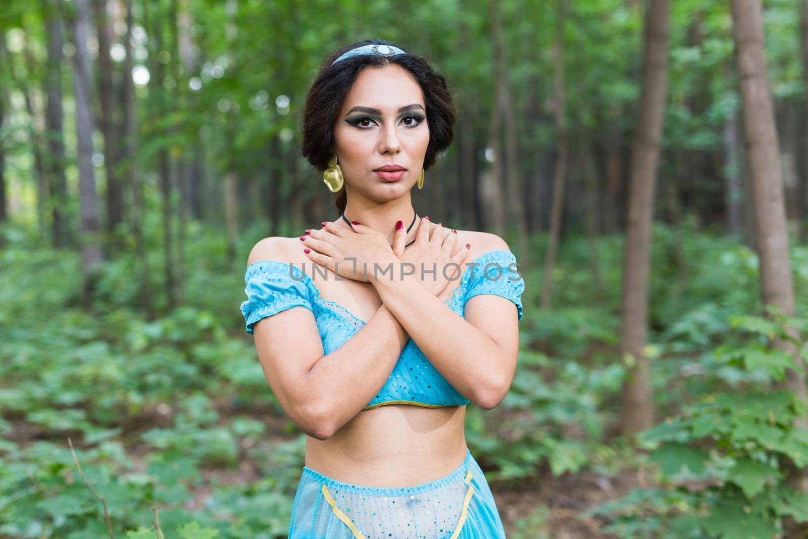 Portrait of young woman in the image of an Eastern fairy Princess in modern clothes.