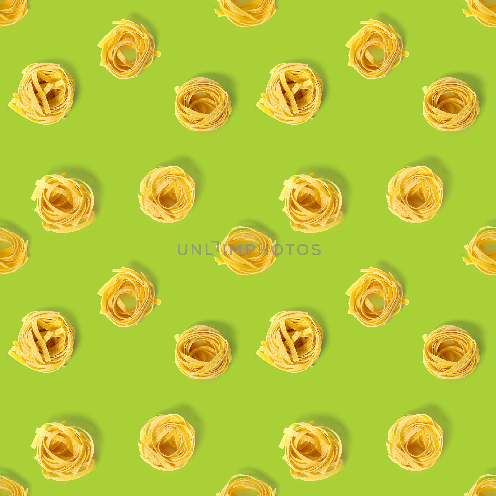 Seamless pattern from Italian tagliatelle pasta. raw pasta fettuccine, pop art background, flat lay. Italian raw nest pasta isolated on green.